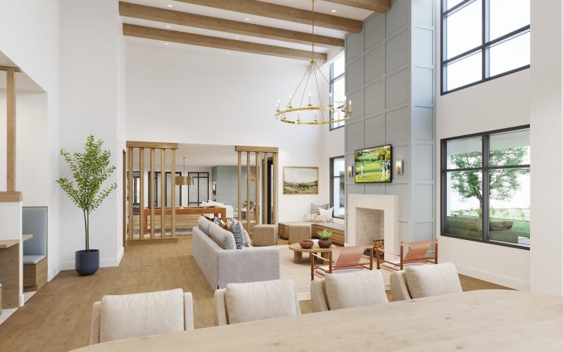 a clubroom with tables, chairs, a tv and a couch