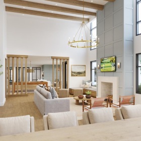 a clubroom with tables, chairs, a tv and a couch